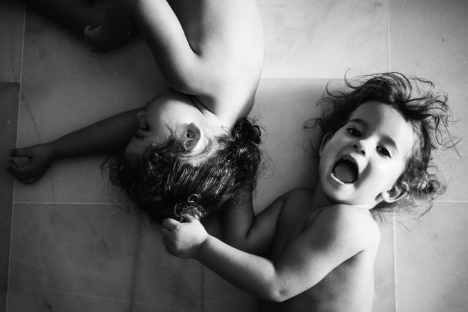 Cute little girls playing at home