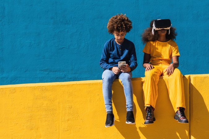 Black teenagers using modern gadgets