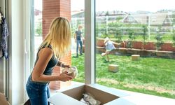 Woman unpacking moving boxes