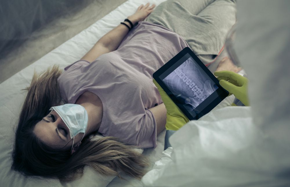 Sick woman lying on a stretcher in a hospital