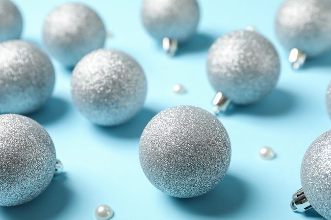 Christmas balls on blue background, close up