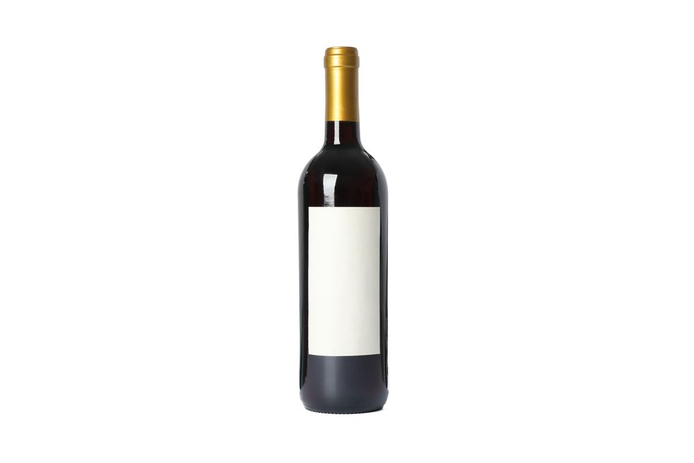Bottle of red wine with empty space isolated on plain background
