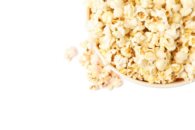 Bucket with popcorn isolated on blank background, top view