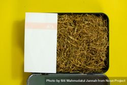 Top view of box of loose leaf tobacco with rolling papers 41lpxL