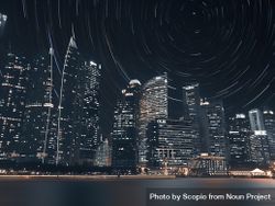 Star trail in sky over city skyline during night time 4mww70
