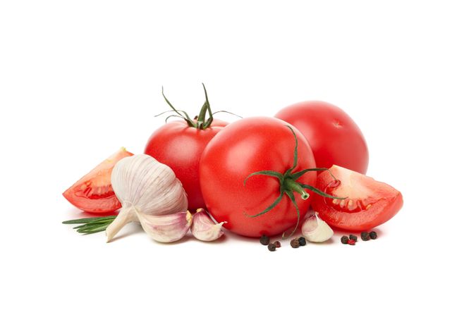 Tomatoes and ingredients isolated on neutral background