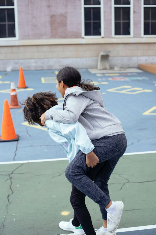 Two children playing in school yard