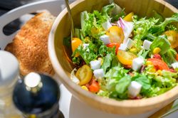 Bowl of healthy salad with lettuce and vegetables
