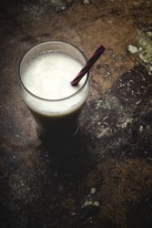Glass of milk on table