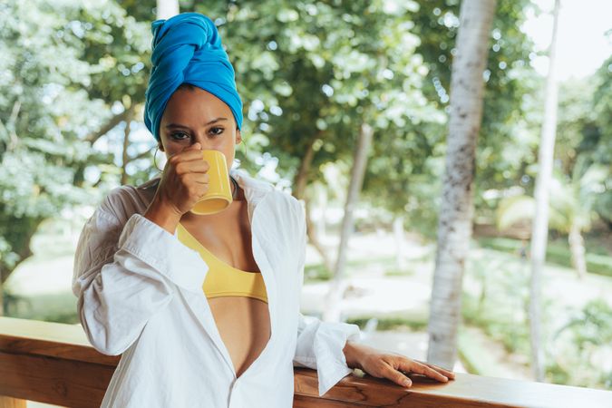 Woman in turban drinking coffee