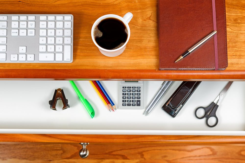 Coffee on top of cherry wood desktop