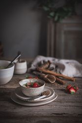 Strawberry porridge in bowl on table