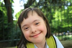 Close up of cute young child smiling at the camera