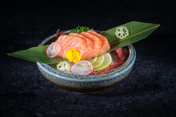 Salmon sashimi with lime slices