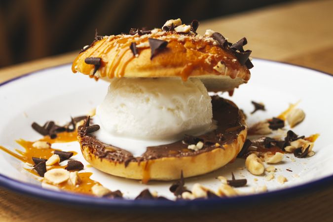 Tasty sweet burger with chocolate crumb and nuts