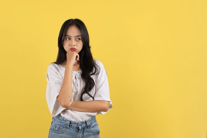 Young Asian Teen Girl Pouting Mouth, Bad mood and Unhappy.