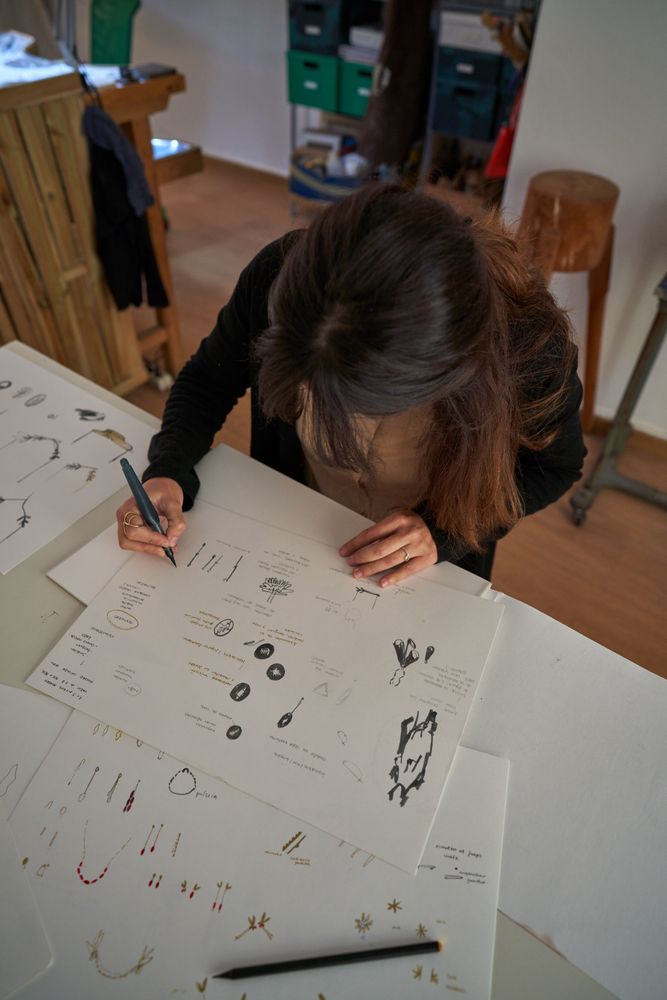 Creative designer drawing sketches of accessories