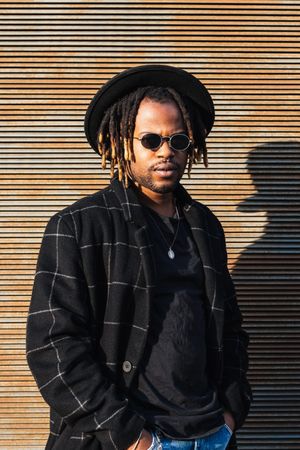 Stylish Black man with dreadlocks on street