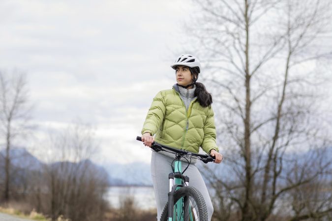 Young woman taking a break during a bicycle ride.