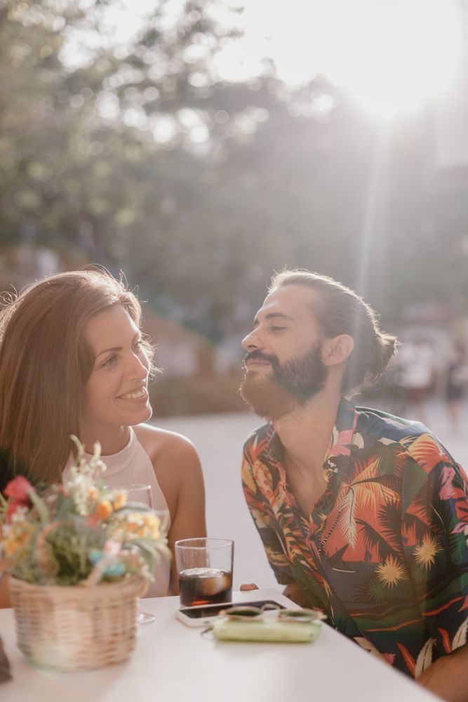 Loving couple sitting on cafe terrace