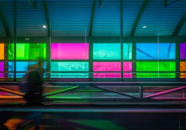 blur and moved person standing on travelator in airport