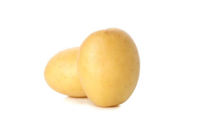 Two whole potatoes on blank background