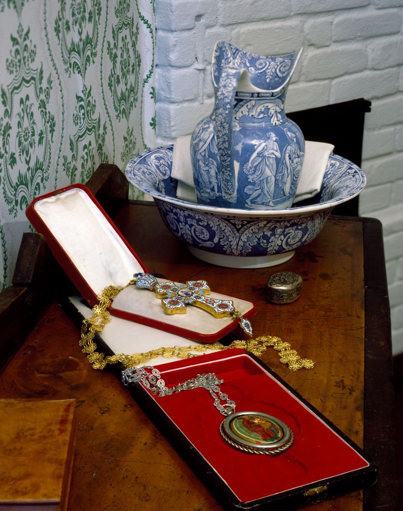 Blue vase and gold religious artifacts displayed in Alaskan history museum