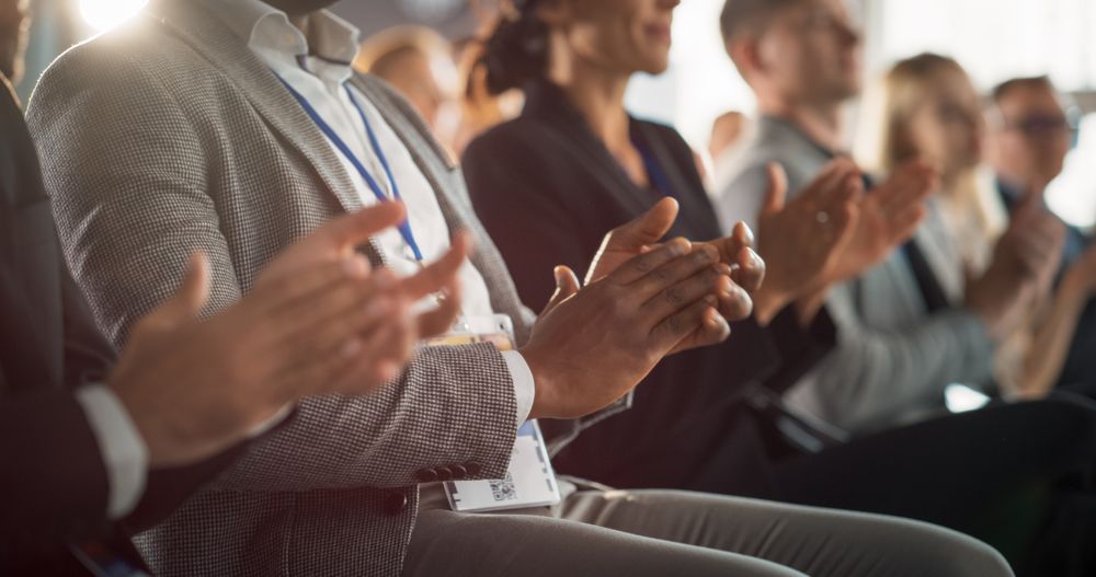 Close-Up on Hands of Audience of People Applauding in Concert Hall During Business Forum Presentation. Technology Summit Auditorium Room With Corporate Delegates. Excited Entrepreneurs Clapping.