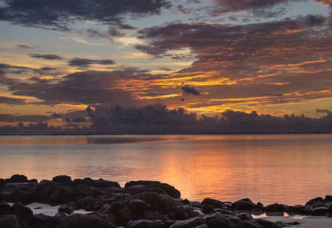 Orange and purple sky reflected in Indian Ocean
