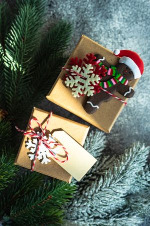 Christmas gifts with pine and gingerbread ornament