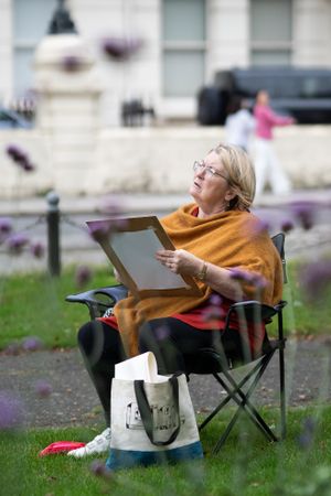 Woman looking up while drawing