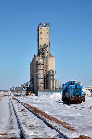A bright-blue yard engine adds a splash of color to a wintry scene near Miloma, Minnesota