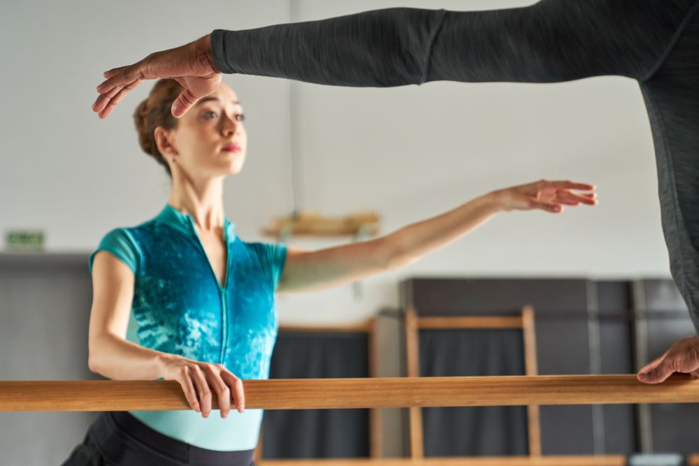 Ballet dancer warming up and dancing at a dance academy