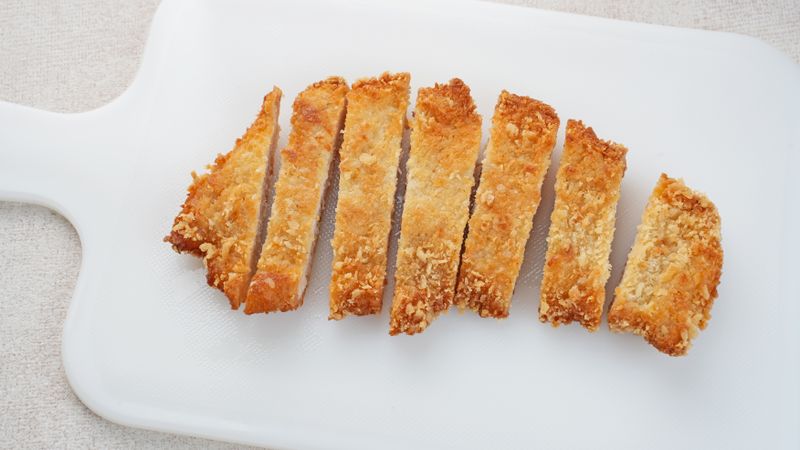 Deep fried chicken cutlet tonkatsu, Japanese food on light background
