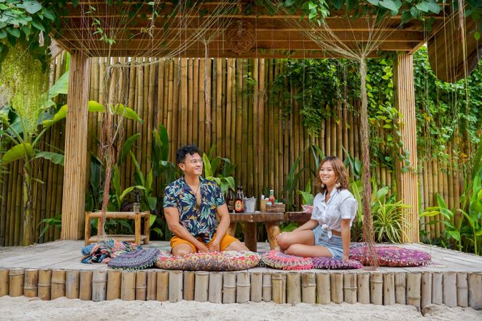 Man and woman on a date in a wooden gazebo