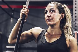 Serene woman relaxing in gym