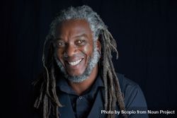 Man with dreads smiling 5qQoE5