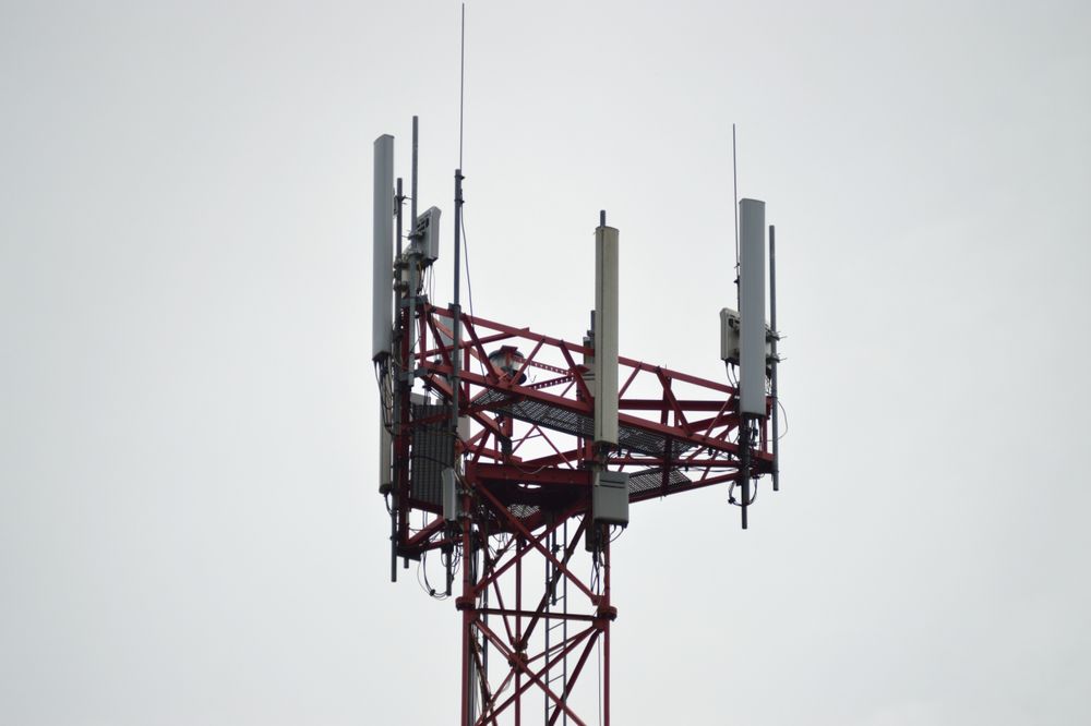 Telecommunication Tower with Antennas Against Clear Sky Background