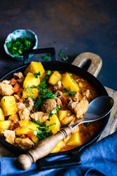 Georgian meat and vegetable dish Souzi served with herb, with copy space