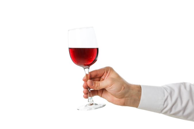 Male hand hold glass with wine, isolated on plain background