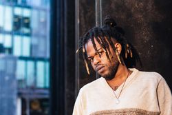 Stylish Black man with dreadlocks in buns