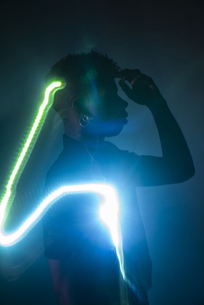 Traces of light on faces of dancer