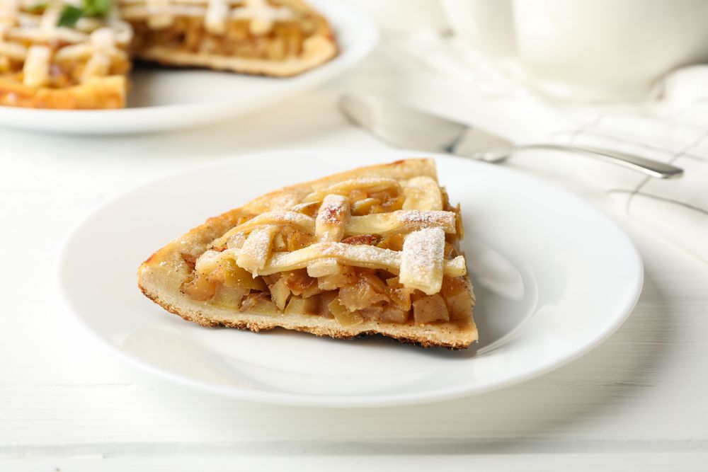 Composition with apple pie on wooden background. Tasty lunch. Homemade breakfast