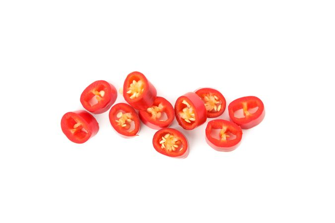 Chilli pepper slices isolated on blank background