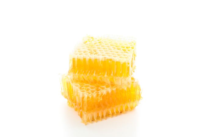 Pieces of honeycomb isolated on plain background, close up