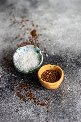 Two small bowls of flax seeds and salt