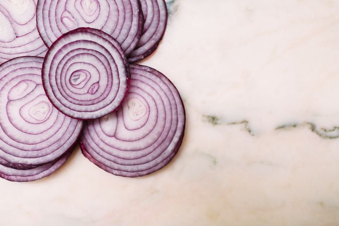Slices of onion on tabletop