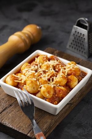 Gnocchi with tomato sauce and grated Parmesan cheese.