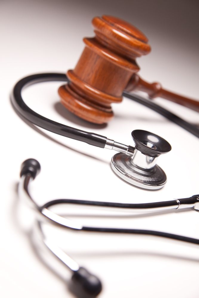 Gavel and Stethoscope on Gradated Background