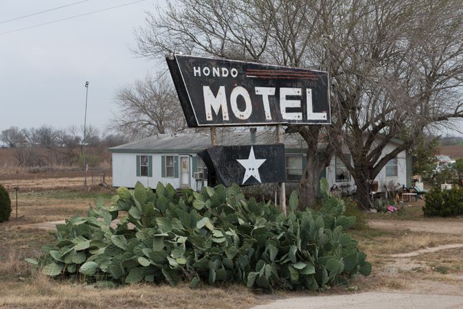 Sign for the distressed Hondo Motel in Hondo, Texas